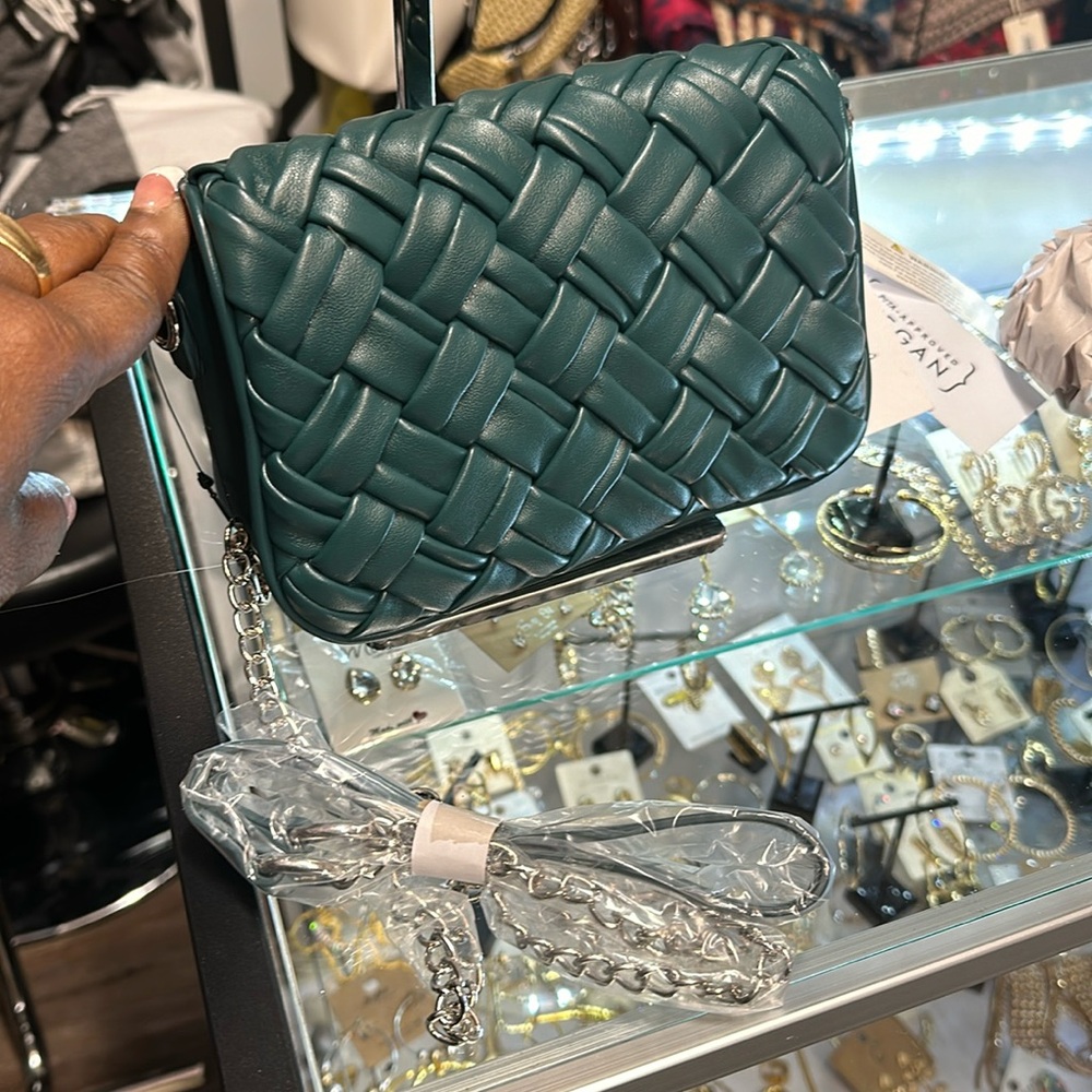 A Weave crossbody green purse